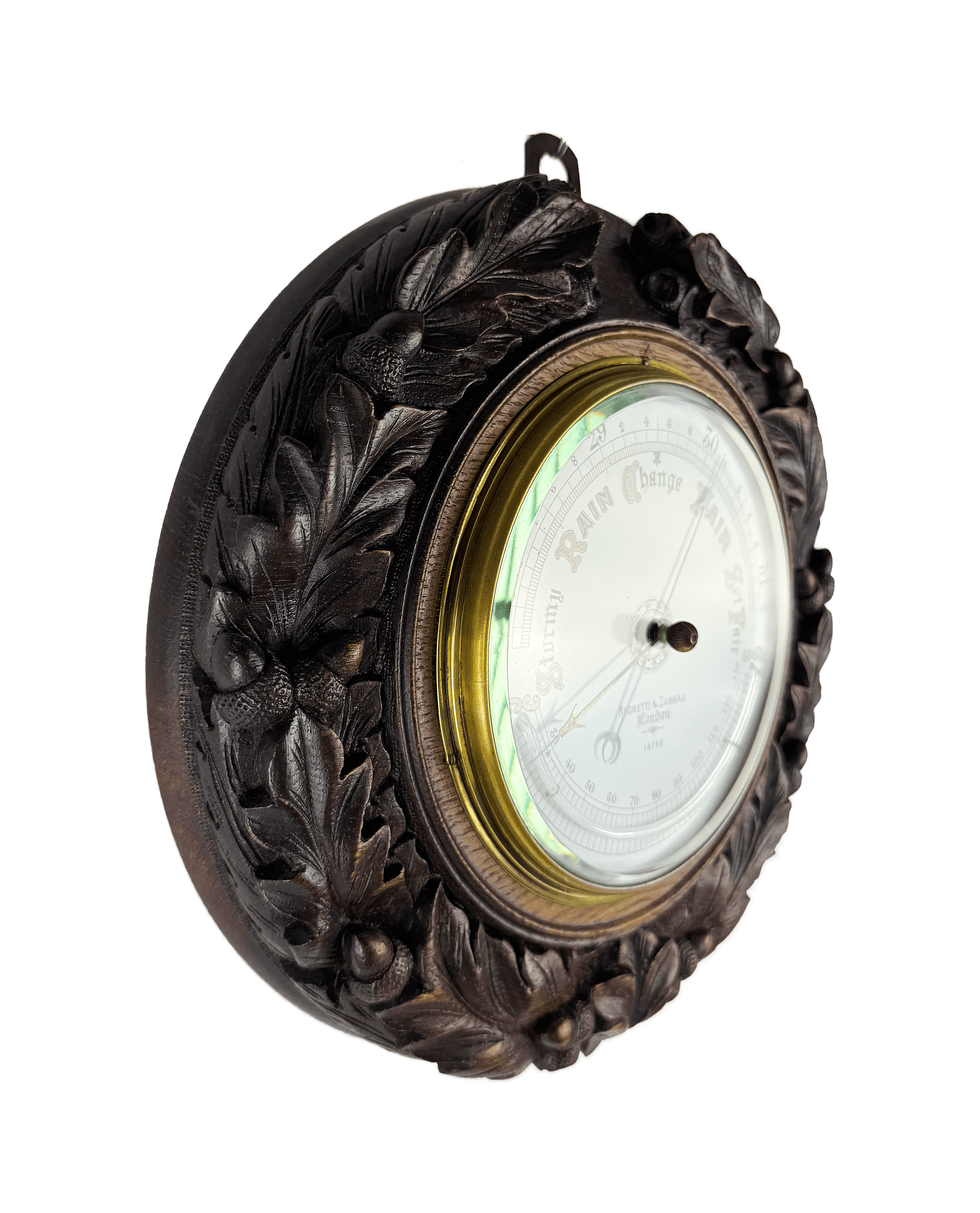 Carved oak round aneroid barometer